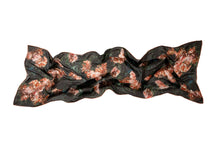 Load image into Gallery viewer, Scarf displayed flat but ruffled. The design is inspired by a painting, with pink flowers on a green background.
